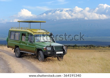 Safari game drive on Kilimanjaro moun background. Kenya, Africa