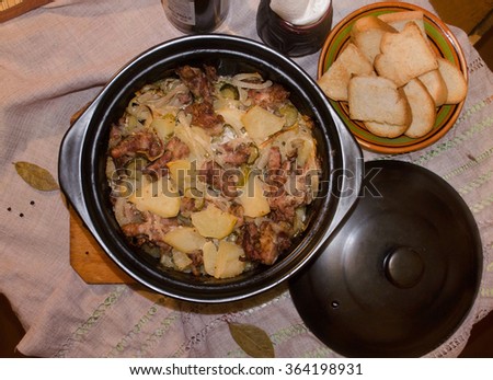 Home cooked hot meat and potatoes in the pot