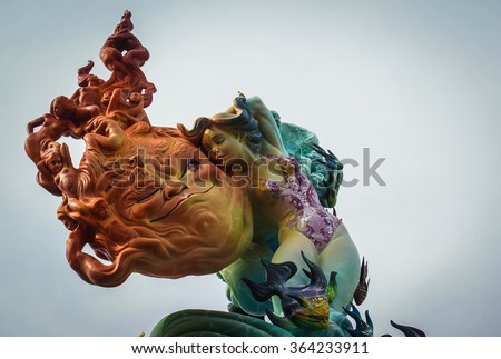 Picture of a sculpture of a girl with the sun on the Las Fallas festival in Valencia, Spain