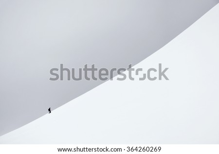 Background photo of man walking through snowy mountains in Norway