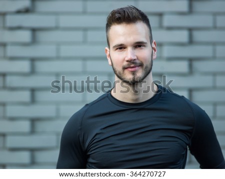 Young runner smiling, portrait Royalty-Free Stock Photo #364270727