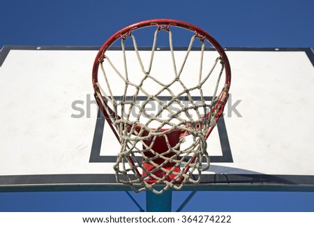 Basketball Hoop and Net on blue sky background