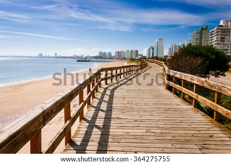 Deck at the beach in Punta del Este Royalty-Free Stock Photo #364275755