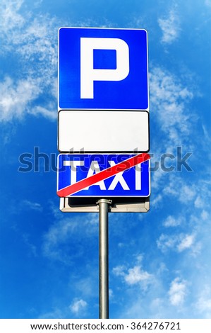Parking sign with blank white sign and crossed taxi sign