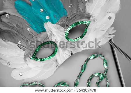 Close up of carnival mask on a blue background.