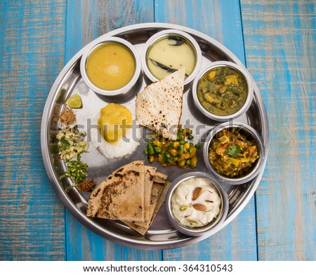 typical Healthy maharashtrian Food Platter or Thali full of nutrients, selective focus  Royalty-Free Stock Photo #364310543