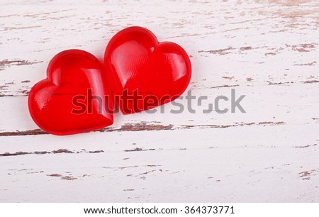 Valentine's Day background. Two hearts on wooden background 