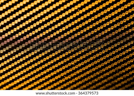 Kevlar abstract golden background.