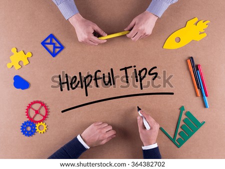 Business Team with a single word Helpful Tips