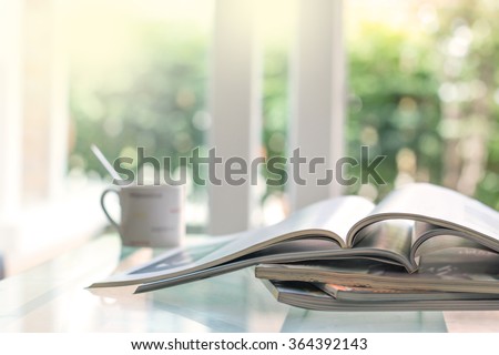 selective focus of the stacking magazine place on table in living room Royalty-Free Stock Photo #364392143