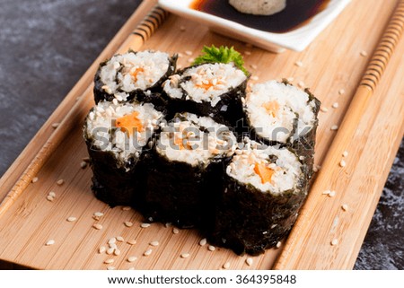 sushi on a wooden desk, horizontal, close up