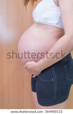 Asian pregnant women, Belly of a pregnant woman.