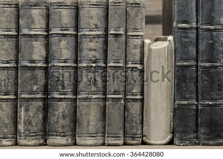 Old Shabby Books With Black Leather Cover On The Bookshelf Horizontal Background Texture