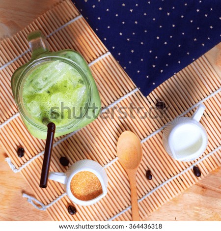 Green tea coffee on wooden texture table