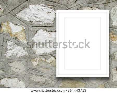 Close-up of one white picture frame on grey old stone wall background