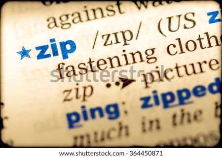 Close-up of word in English dictionary. Zip, definition and transcription
