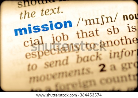Close-up of word in English dictionary. Mission, definition and transcription