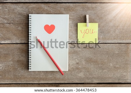 Notebooks, clip boards, Notepad, pencil Arranged in is the meaning I Love You. Valentine Concepts