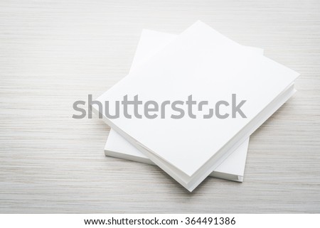 Blank white mock up book on wooden background - filter effect processing