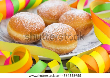 Homemade german donuts - krapfen or berliner - filled with jam. Selective focus and natural light. 