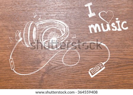 Scetch of earphones on the wooden background
