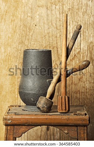 pottery for making chocolate with wooden utensils with wooden background