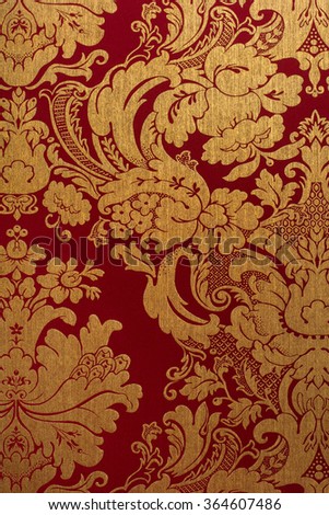 Floral gold and red pattern on seamless background.