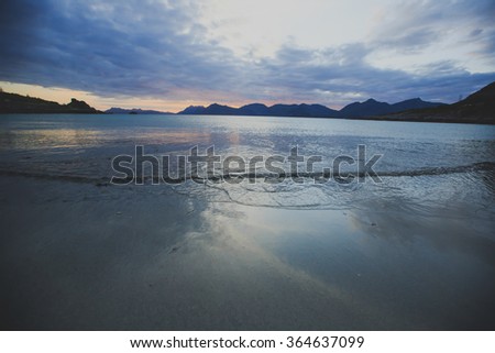 Sunset or dusk on a beautiful norwegian white sand beach, Lofoten Islands