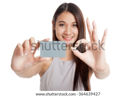 Blank card in beautiful young Asian woman hand  show OK sign isolated on white background