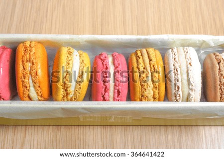Closed up of Colourful Macarons on Wooden Table Background, selective focus, top view
