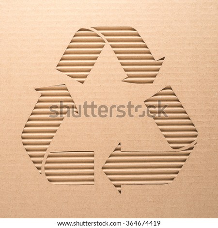Recycle sign on a corrugated cardboard 