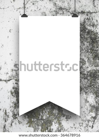 Close-up of one hanged medieval standard with clips on grey weathered concrete wall background