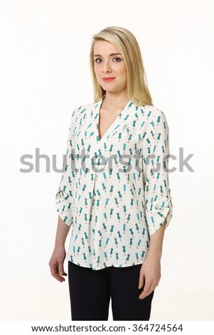 blond fashion model girl with long straight hairstyle in printed casual blouse and trousers smiling portrait isolated on white