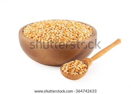 corn grain in wooden kitchen utensils