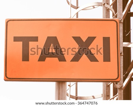  Orange Taxi sign over blue sky picture vintage