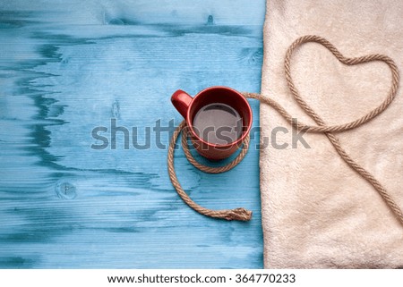 A cup of coffee on the wooden table