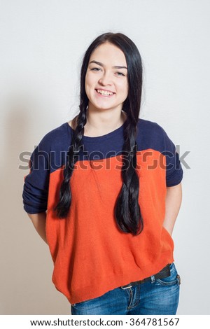 portrait of a beautiful young girl on a light background