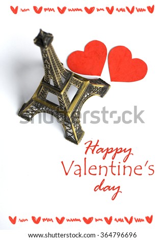 Eiffel tower and hand with paper hearts on white. Paris cards as symbol love and romance travel honeymoon in Paris, travel to France. Valentines day card. Selective focus image