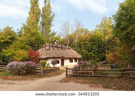 Old house of the peasants and the fence at the Museum of Pirogovo. Ukraine Royalty-Free Stock Photo #364813205