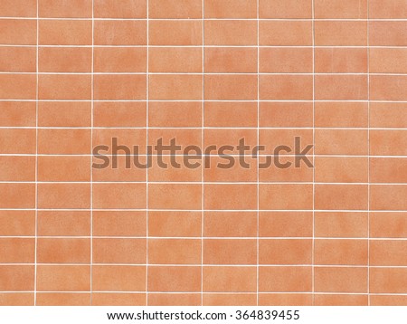 Pattern of orange brick wall, symetric layout.