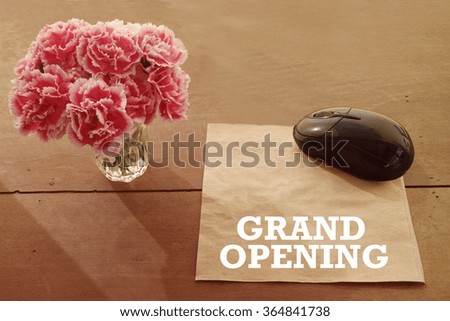 GRAND OPENING concept on paper and mouse computing with pink flower,color filter image , business concept, business idea
