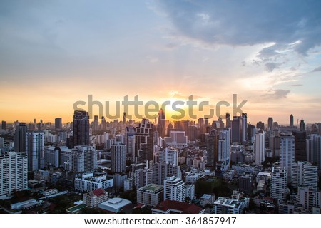 view of Sunset over cityscape Royalty-Free Stock Photo #364857947