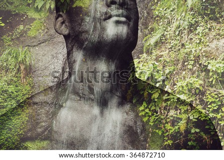 Feel the nature. Digitally composed close-up picture of shirtless young African man over the picture of waterfall