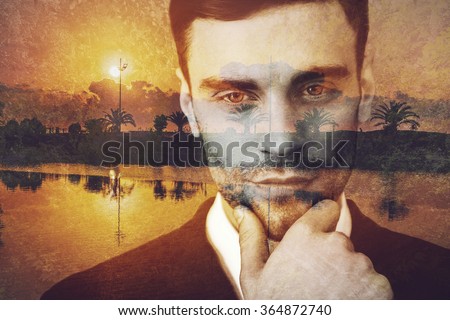Looking for new destinations. Digitally composed picture of young businessman holding hand on chin and looking away over the picture of landscape with palm trees
