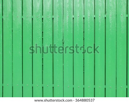 Vertical green wood fence background.