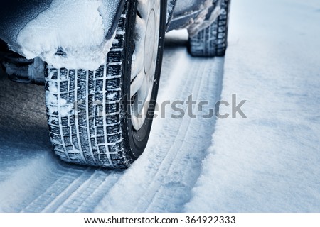 Closeup of car tires in winter  Royalty-Free Stock Photo #364922333