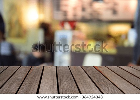 blurred image wood table and abstract coffee shop background