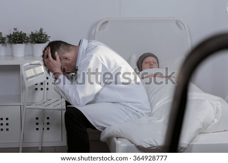 Picture of a sad doctor grieving his patient