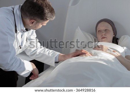 Picture of a doctor supporting his sick patient