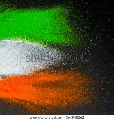 Indian Republic Day celebration background. Red, green and saffron color powders splashed over dark background.  Royalty-Free Stock Photo #364948262